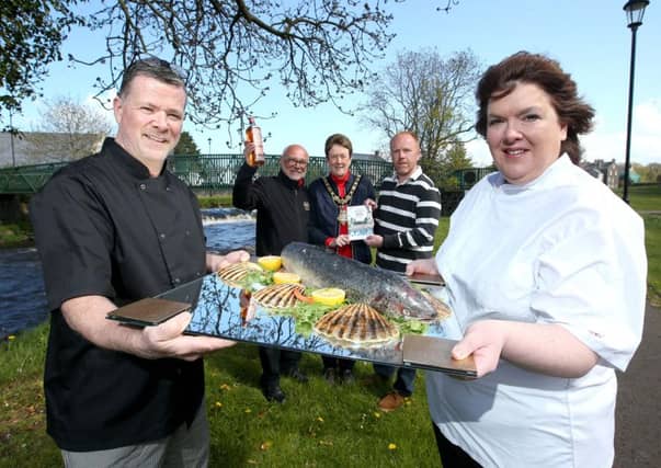 Gary Stewart and Paula McIntyre pictured with Niall Mehaffey from Bushmills Distillery; the Mayor of Causeway Coast and Glens Borough Council, councillorJoanBaird; and Tim Delargy from Department of Environment, Agriculture and Rural Affairs at the launch of Bushmills Salmon andWhiskey Festival
