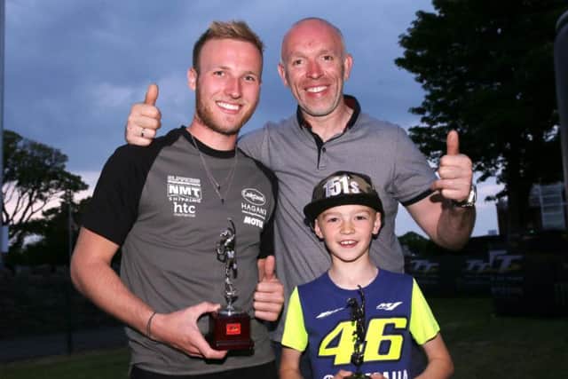 Impressive TT newcomer Davey Todd with Burrows Engineering Racing team boss John Burrows and his son, Jack.