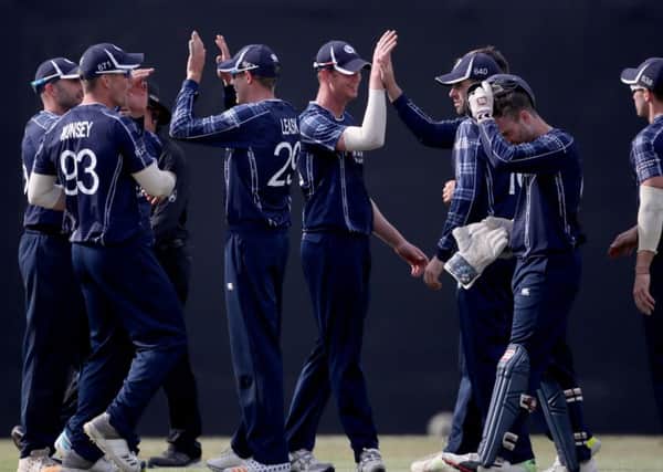 Scotland's players celebrate after Kyle Coetzer caught out England's Sam Billings during the One Day International at The Grange