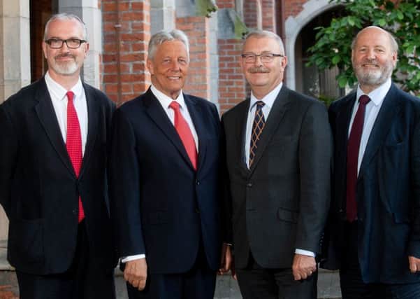 Peter Robinson (second left) poses before his speech with Professor Richard English, pro-vice-chancellor for Internationalisation and Engagement, Professor James McElnay, acting president and vice-chancellor of Queens and Professor John Brewer, acting director of the Senator George J Mitchell Institute for Global Peace, Security and Justice at Queens