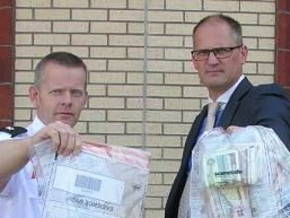 Pictured, left to right, Superintendent Jeremy Lindsay and Detective Inspector Blemmings with some of the items, including suspected drugs, seized in the Coleraine area on Thursday.