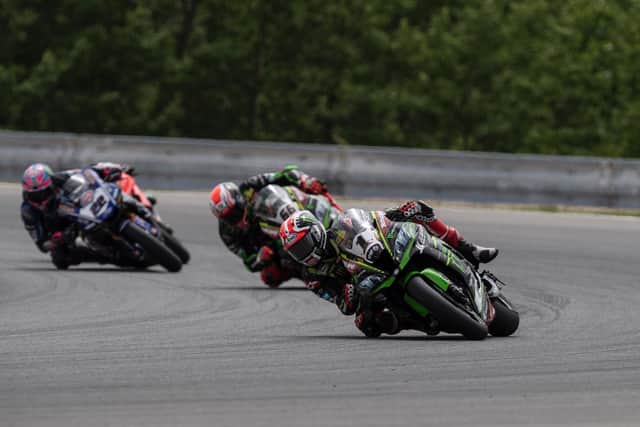 Jonathan Rea crashed out of Sunday's second World Superbike race at Brno in the Czech Republic following contact with his Kawasaki team-mate Tom Sykes.