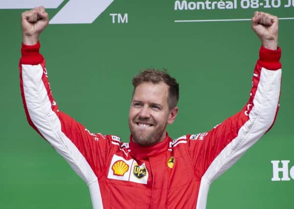 Ferrari's Sebastian Vettel of Germany celebrates his victory at the Canadian Grand Prix