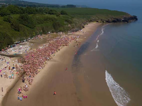 Handout photo issued by Graceful Digital of an aerial view of people taking part in the strip and dip world record attempt in Co Wicklow on Saturday.
