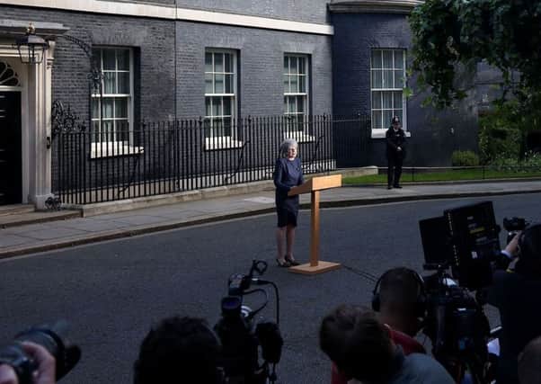 Prime Minister Theresa May in April 2017 makes a statement in Downing Street, London, announcing a snap general election to be held on June 8. She was attempting to increase her parliamentary majority, but instead lost it, making difficult implementation of various policies including social care reform and Brexit. Photo: Philip Toscano/PA Wire