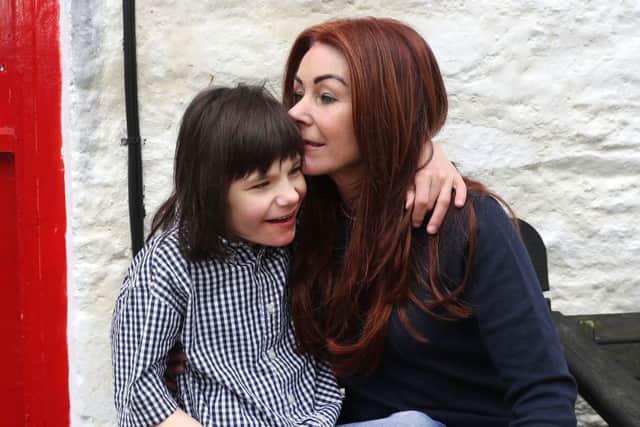 Billy Caldwell with his mother Charlotte. She will have to fight more battles to have restored to her the other bottles of medical cannabis. Photo by William Cherry/ Press Eye