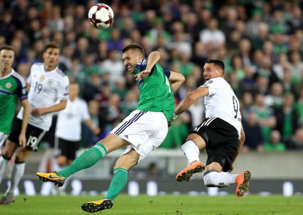Northern Ireland lost 3-1 at Winsdor Park as the Germans produced the goals to dismiss  their World Cup bid