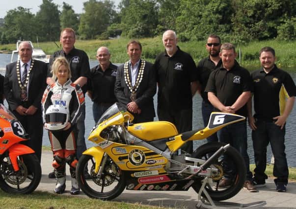 Members of Fermanagh and Omagh District Council, including Chairman Cllr Howard Thornton and  Director Robert Gibson, pictured with Enniskillen and District Motorcycle Club members, including Chairman Rodney Shaw, Club and Race Secretary Fiona Ferris and Vice Chairman Trevor Kennedy, with racer Melissa Kennedy and Gary Dunlop (Joey's Bar Racing).
