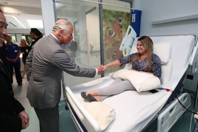 The Prince of Wales meets dialysis patient Eaimie Gormley as he visits Omagh Hospital as part of his tour of Northern Ireland