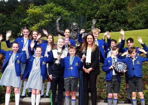 Irish 100m record holder Amy Foster pictured with pupils from Downey House,who recorded the best overall score in the 28th annual Belfast Parks Primary Schools Athletics Shield and Cup. Also pictured is Councillor Kate Nicholl, Chair of Belfast City Councils People and Communities Committee.