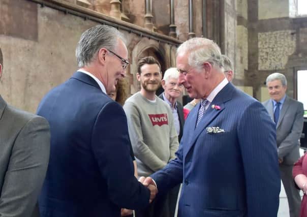 Prince Charles shakes hands with Sinn Fein's Gerry Kelly during his visit to Belfast on Tuesday. Photo: Simon Graham.