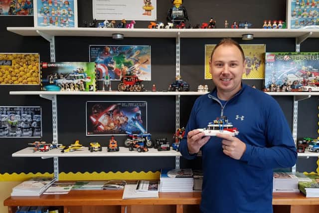 Scott Gordon with his LEGO collection which is on display at Brownlow College where he teaches