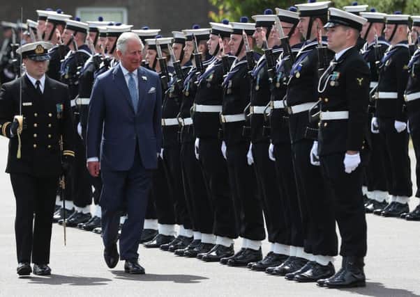 The Prince of Wales inspects a guard of honour
during a visit to the Naval Base, near Cork as part of his tour of the Republic of  Ireland. Photo: Steve Parsons/PA Wire