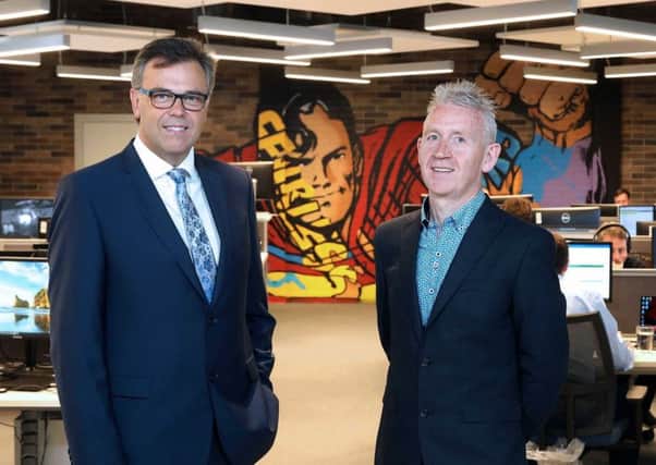Invest NI chief executive Alastair Hamilton, left, pictured last week with Novosco managing director Patrick McAliskey for the announcement of 150 jobs - one of the biggest investment and job successes of the year so far