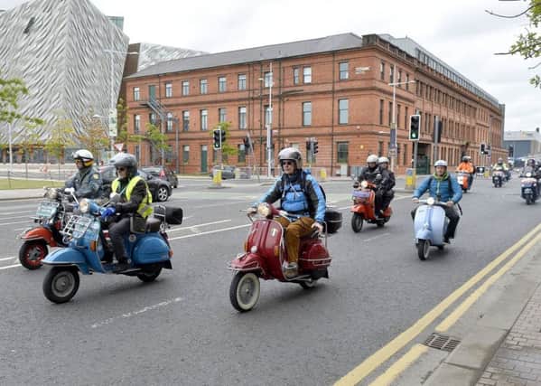 Scooter enthusiasts from around the world pictured as they leave Titanic Belfast on a ride out which will end at Cultra.  Credit: Presseye/Stephen Hamilton