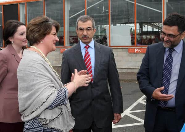 Dr Raied Al Wazzan, centre, with, left, Emma Little-Pengelly MP, Arlene Foster MLA and, right, Dr Saleem Taneen
 at an event to mark the end of the Muslim holy month of Ramadan on Belfast's Boucher Road