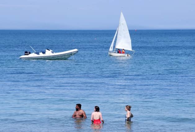 There has been an exceptional spell of weather in Northern Ireland since late May, with 19 days in which the temperature always rose to 20 Celsius or higher. Above, people enjoy the good weather on Sunday June 3 at Helen's Bay in Co Down. 

Picture by Jonathan Porter/PressEye