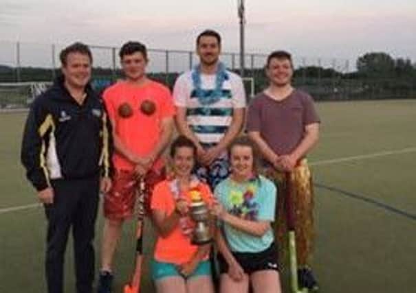 Kilrea YFC pictured with YFCU president, James Speers (far left) collecting the John Bradley Cup after winning the 2018 Hawaiian hockey challenge