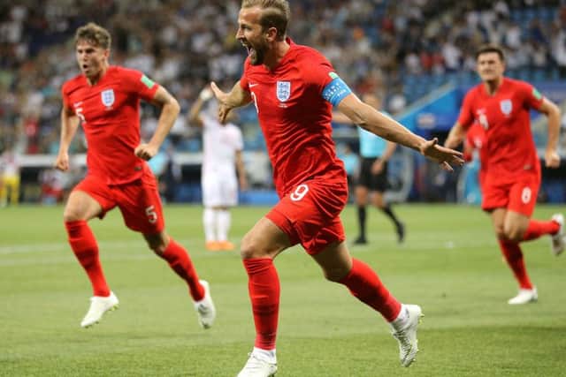 England's Harry Kane (centre) celebrates scoring his side's first goal of the game during the FIFA World Cup Group G match against Tunisia at The Volgograd Arena, Volgograd.