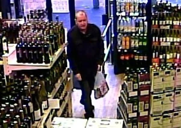 A CCTV still of Basil McAfee entering an off-licence on Henderson Avenue on the afternoon of Thursday, December 19, 2013. His body was found in his north Belfast home the following day.