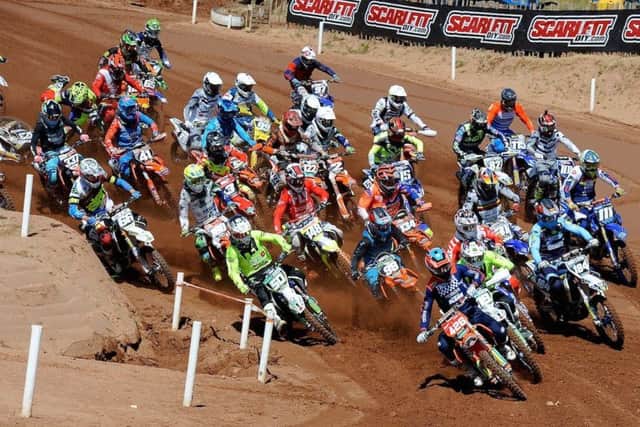 Conrad Mewse (426) leads the pack  in the MX2 start~1