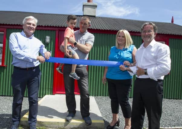 Pictured L-R at the official opening of Watertown House at the Silent Valley reservoir is Dr Len OHagan CBE Chairman NI Water, John and Tom Haugh, Marie Ward, Newry, Mourne and Down District Council and Dr Jim McGreevy, Heritage Lottery Fund.