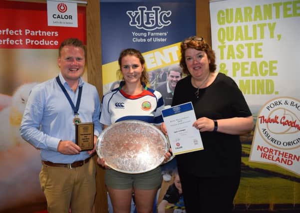 Katie Witherspoon, Lisnamurrican YFC collects first place in the senior section of the home management competition. Katie (centre) is pictured with YFCU president, James Speers (left) and Paula McIntyre (right)