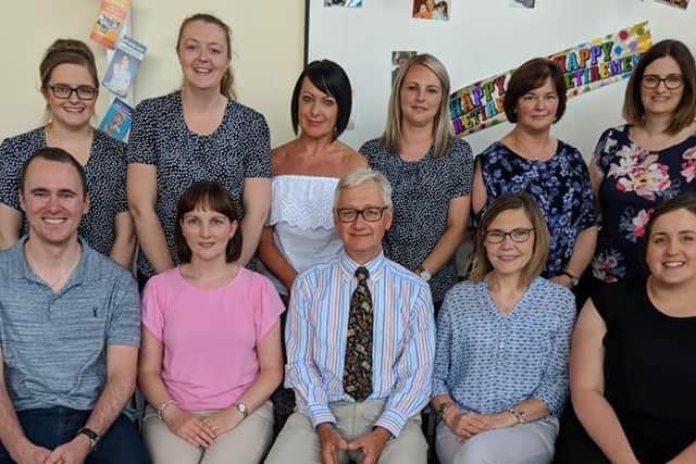 Dr Peter Howie (seated, centre) with colleagues at Larne Health Centre.