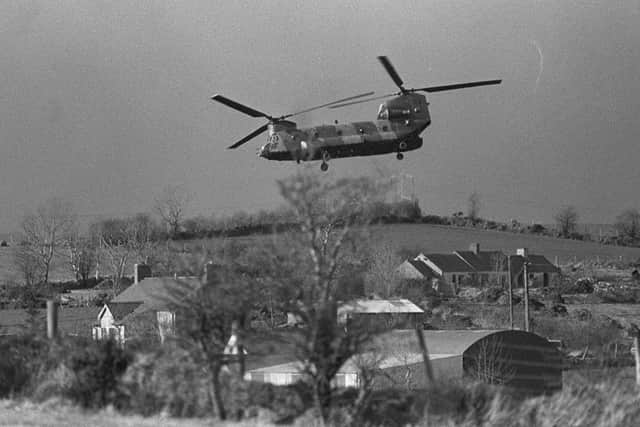 A Chinook helicopter pictured over farmhouses in South Armagh in March 1988. Pic: Pacemaker