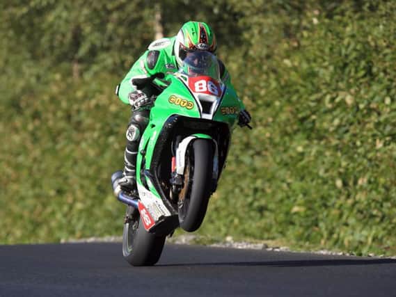 Derek McGee won the opening Superbike race on his Kawasaki ZX-10R at the Enniskillen Road Races by almost 17 seconds on Saturday.