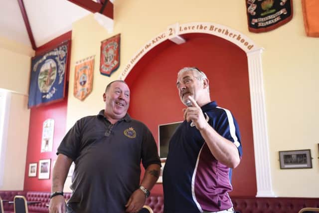 Gary Watson (left) from Ballynafeigh Cultural and Heritage Society and Liam McKenna (right) from Bredagh GAC during a tour of the Ballynafeigh Orange Hall in Belfast.