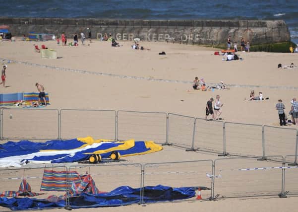 The scene on Gorleston beach in Norfolk, after a young girl died after reportedly being thrown from a bouncy castle.