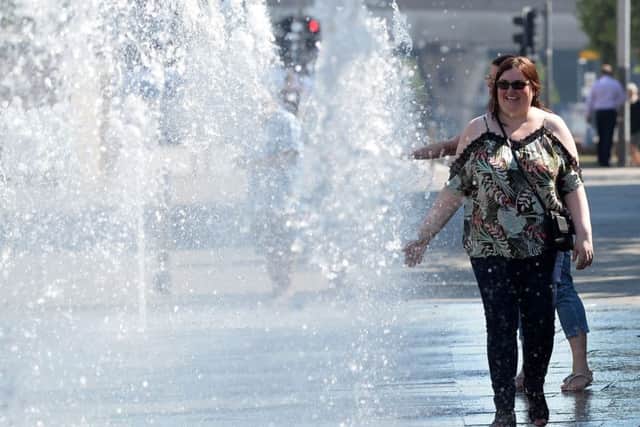 Pacemaker Press 28/06/2018 
Cooling  down at the water fountain  during the hot weather in Belfast on Thursday, that is thought to be the hottest day of the year, as the sunshine continues.
Pic Colm Lenaghan/Pacemaker
