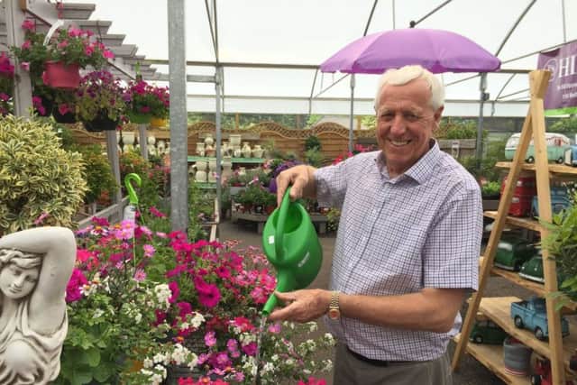 Robin Mercer, owner of Hillmount Garden Centre, has seen a rush on the purchase of watering cans. Pic by David Young/PA Wire