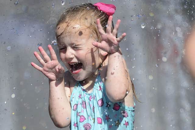 Four-year-old Willow Knocker from Belfast was among those having a splashing time amid the heat on Monday