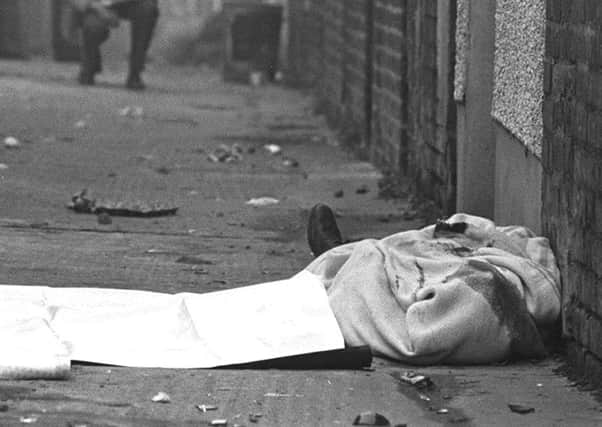 The body of Catholic man Joseph Donegan lying in the Shankill Road area after being murdered by remnants of the Shankill Butchers gang in October 1982