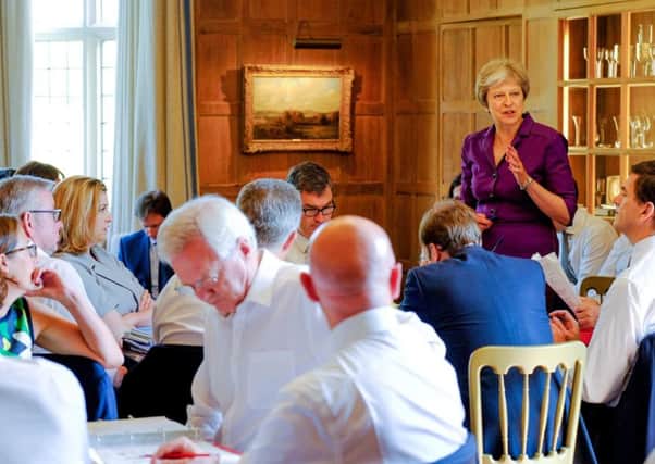 Theresa May addresses members of the Cabinet during Fridays meeting at Chequers to thrash out an agreed Brexit position
