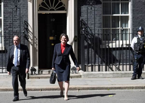 Arlene Foster, leader of the Democratic Unionist Party, and the party's deputy leader, Nigel Dodds, leave Downing Street following a meeting with Prime Minister, Theresa May, on Monday. Photo: Stefan Rousseau/PA Wire