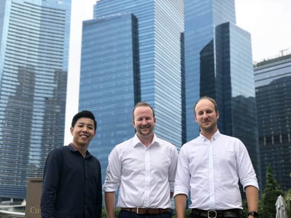 Kwok Zhong Li, co-founder of Finty, with David Boyd and Andrew Boyd, co-founder of Credit Card Compare, pictured in Singapore