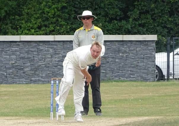 Downpatrick's Ross Boultwood bowling against Laurelvale at the weekend