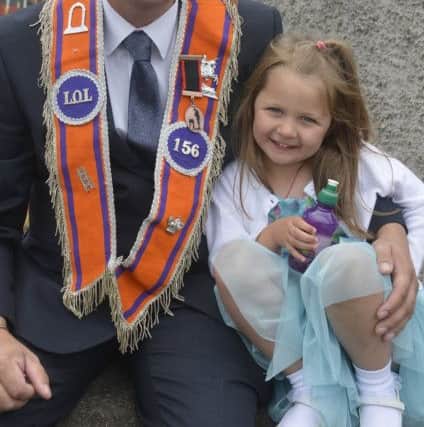 Ian Graham and his daughter Jessie Mae enjoying a quiet moment before the parade begins in earnest