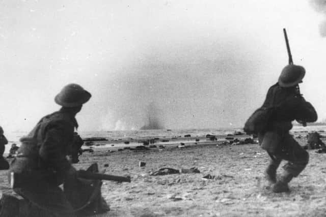British soldiers fire at low flying German aircraft at Dunkirk