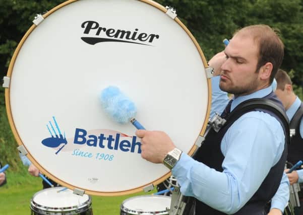 Philip Capper pictured playing the bass drum for Battlehill Pipe Band in August last year. Pic: John Kelly
