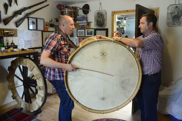 Graeme Cousins pictured with David Alexander learning to play the Lambeg drum. 
Picture by Arthur Allison