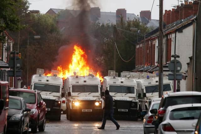 Police closed off streets around Bloomfield Walk bonfire in east Belfast after it was set on fire during the night. Picture by Jonathan Porter/PressEye