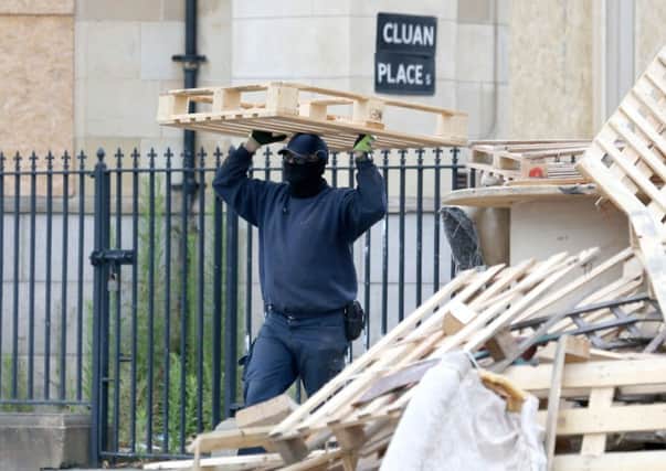 Contractors were called in to remove the Cluan Place bonfire on July 11 following a High Court injunction