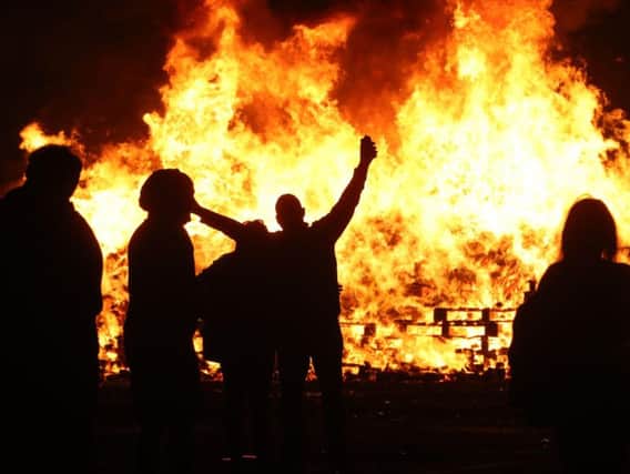 People attending an 11th night bonfire