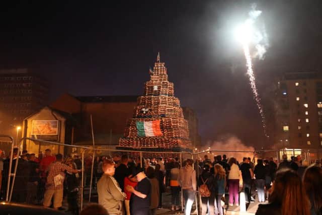 An EU flag is burned on an 11th night Bonfire in the Sandy Row area of Belfast