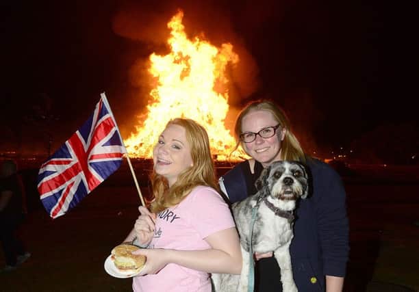 People pictured enjoying the  Kilcooley bonfire in Bangor  Co Down, Northern Ireland. (Photo: Arthur Allison/PACEMAKER)