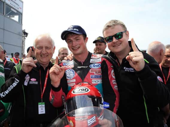 James Cowton with McAdoo Racing's Winston (left) and Jason McAdoo at the North West 200 in May, where he won the Supertwins race.